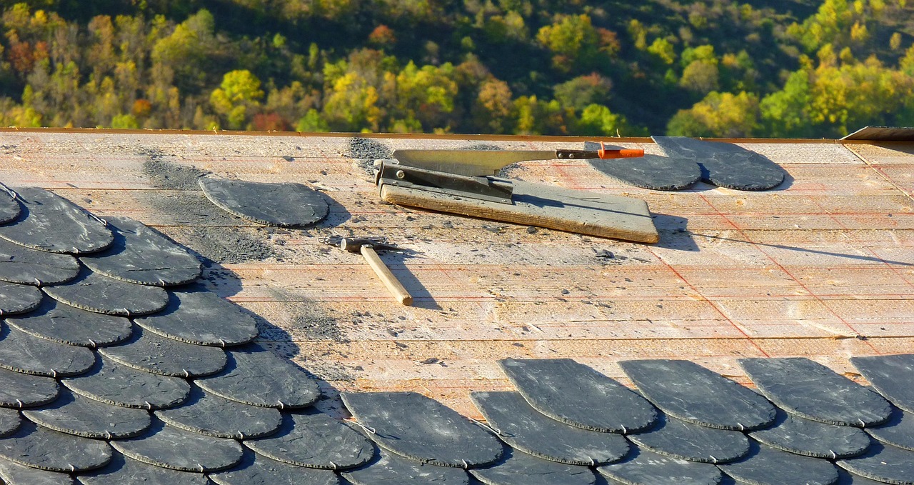Roofer on blue roof
